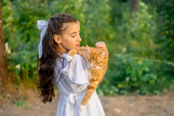 Girl with ginger cat. Beautiful portrait of girl with ginger cat in the hands.