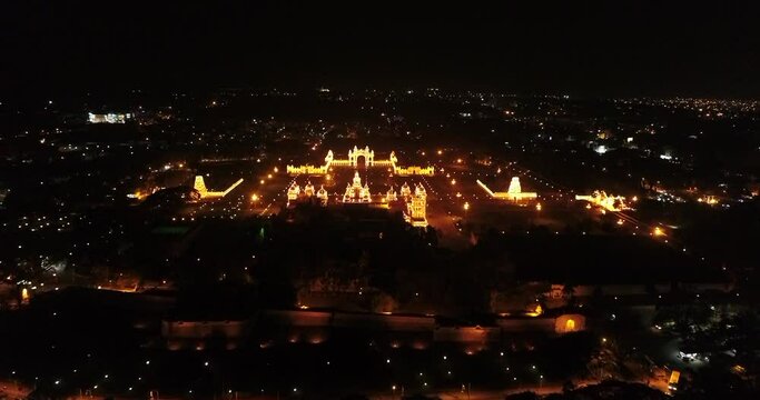 Aerial shot of Mysore palace fully illuminated at night