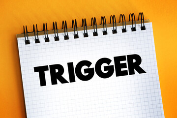 Trigger text on notepad, concept background.