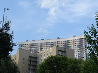 Horizontal full-color photo. Textural composition with parts of facades of city buildings. Urban...