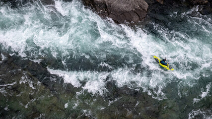 Group of friends spending time on the river enjoying kayaking and rafting together