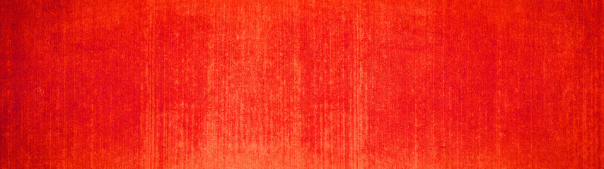 Abstract orange red colored rustic concrete wall texture background banner panorama with vertical...