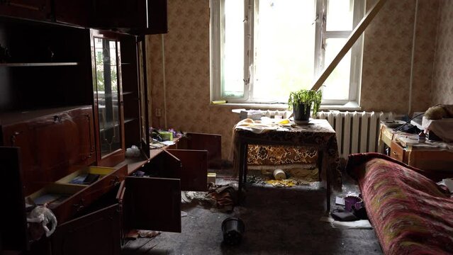 The apartment of the inhabitants after the evacuation during the bombing of a peaceful city. Left belongings of residents. Bombed apartments. Fire in the house. Traces of hits from. Irpin. Ukraine.