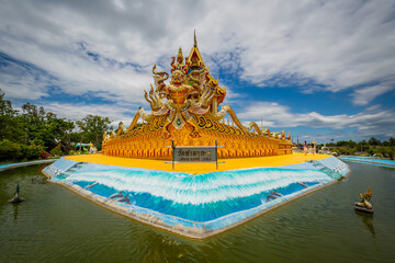 The temple building is shaped like a traditional Thailand boat. The name of the temple is Wat Tha...