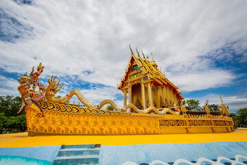 The temple building is shaped like a traditional Thailand boat. The name of the temple is Wat Tha...