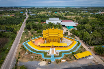 A top view from a drone of the temple building is shaped like a traditional Thai boat at Wat Tha...