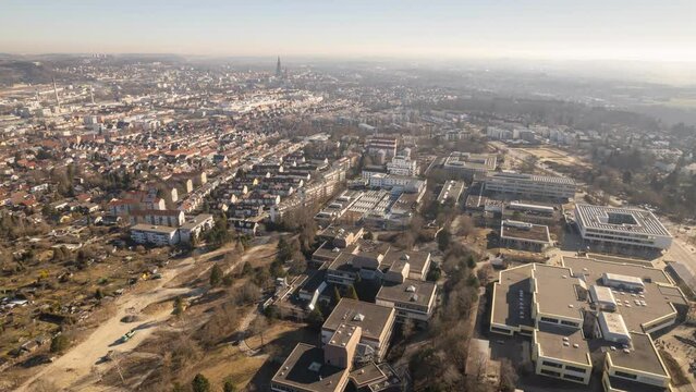 Residential area with school complex at misty morning aerial time lapse
