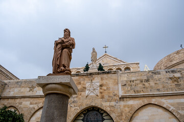 Naklejka premium Saint Jerome (Hieronymus) sculpture on the column at St. Catherine`s Church. Bethlehem