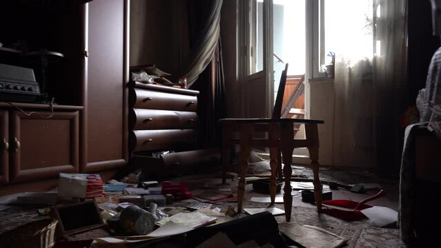 The apartment of the inhabitants after the evacuation during the bombing of a peaceful city. Left belongings of residents. Bombed apartments. Fire in the house. Traces of hits from. Mariupol. Ukraine.