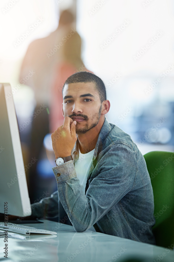 Leinwandbilder Modern and serious businessman working on a desktop computer in a busy office at a tech company. Information Technology software engineer expert on data management system for ux and ui website design
