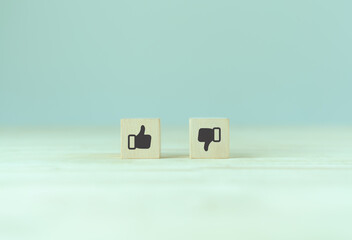 Accepted and rejected concept. Like and dislike icon on wooden cubes with smart background. Thumb...