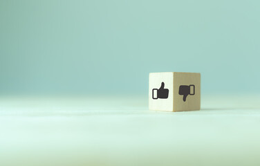 Accepted and rejected concept. Like and dislike icon on wooden cubes with smart background. Thumb...