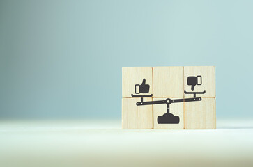 Accepted and rejected concept. Like and dislike on weight scales icon on wooden cubes with smart...