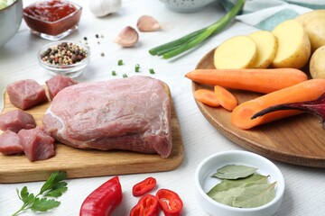 Fresh ingredients for borscht on white wooden table