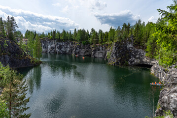 Fototapeta na wymiar Panoramic summer view of Marble Lake in Ruskeala Park in Karelia, Russia. Popular tourist attraction.