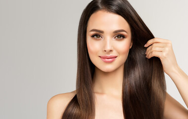 Beautiful model girl with shiny brown and straight long  hair . Keratin  straightening . Treatment,...