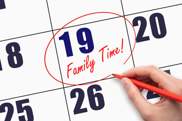 19th day of the month. Hand writing text FAMILY TIME and circling the calendar date.