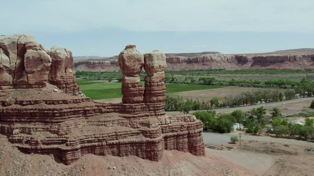 Symmetrical Rock Formations Towering over Desert Town of Bluff, Utah