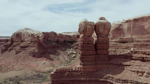 Aerial Drone Flight by Sandstone Cliff Rock Formations in Utah and Arizona's National Park Southwest Desert