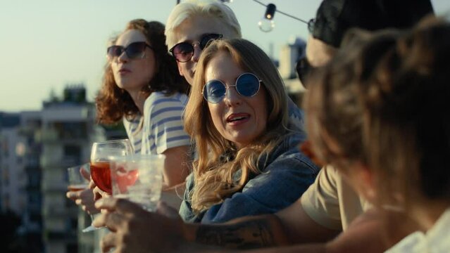 Group of multi ethnicity friends at the party in top of the roof. Shot with RED helium camera in 8K.