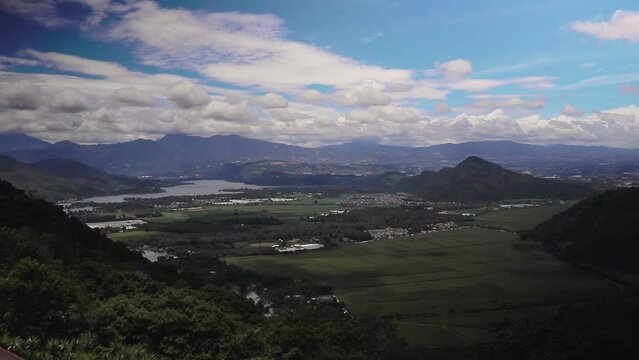 Daytime timelapse wit fast moving clouds overlooking the Amatitlan lake in guatemala city