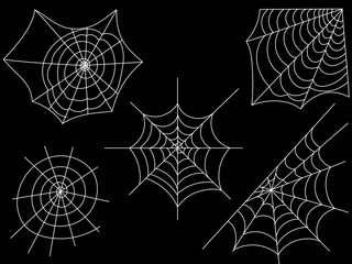 A set of cobwebs is highlighted on a dark background.