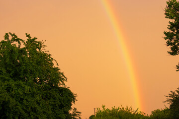 Sunset with a rainbow after a hurricane in the Kharkiv region of Ukraine in the summer of 2022