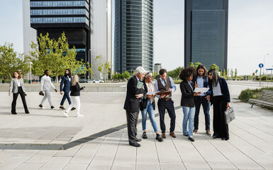 Multiethnic business people working outdoor from office building - Focus on arabian girl face