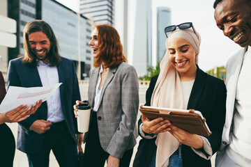 Multiracial business people working outdoor from office building - Focus on arabian woman face