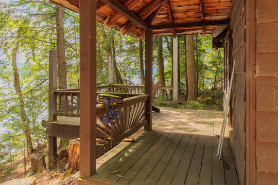 wooden cabin porch in woods