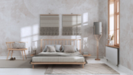 Blurred background, wabi sabi bedroom with macrame wall art and wallpaper. Wooden furniture, carpets and double bed. Japandi interior design