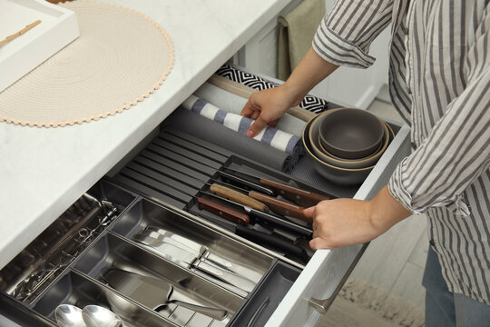 Modern kitchen, Open drawers, Set of cutlery trays in kitchen