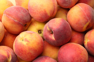 Fototapeta na wymiar Fresh ripe peaches as background, closeup view