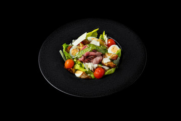 Salad with meat, pesto, tomatoes, boiled egg, lettuce, cheese and zucchini
