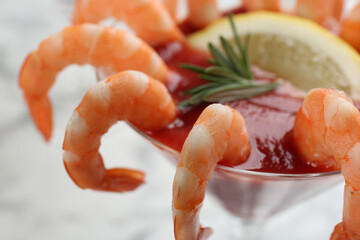 Delicious shrimp cocktail with tomato sauce, closeup