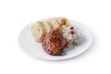Roasted duck leg with sauce, cranberries, cabbage and white bread