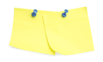 Blank yellow notes pinned on white background, top view