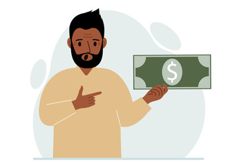 A man holds a large paper bill in his hand. The concept of income, expense, earning or spending money.