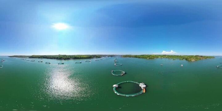 Aerial view of fish ponds for bangus, milkfish. Fish farm, top view. large scale traditional floating fish farms. VR 360. Philippines, Luzon.