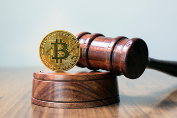  Judge gavel and bitcoin. Cryptocurrency legislation. Bitcoin ban. Violation of law