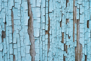 Blue cracked paint on wood