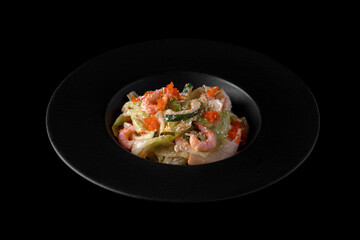 Salad with shrimps, cucumbers, tobiko caviar, salad and sauce