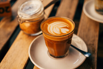 A nice photo of a cup of coffee on a table