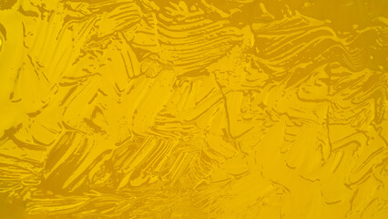 Yellow golden acrylic or oil paint texture. Closeup of the spatula technique paint. Colorful...