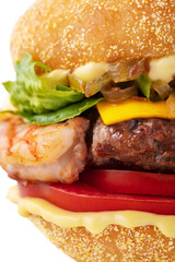 Hamburger with shrimps, cutlet, onion, tomatoes, sauce, cheese and salad