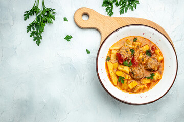 stew lecho with meat on a light background, Restaurant menu, dieting, cookbook recipe top view