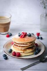 stack of pancakes with berries