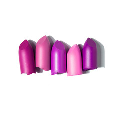 Creative concept photo of cosmetics swatches beauty products lipstick on white background.