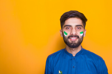 Pakistani Boy with face paint celebrating independece day, indoor photography