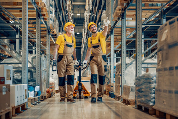 Two workers in uniform at warehouse
